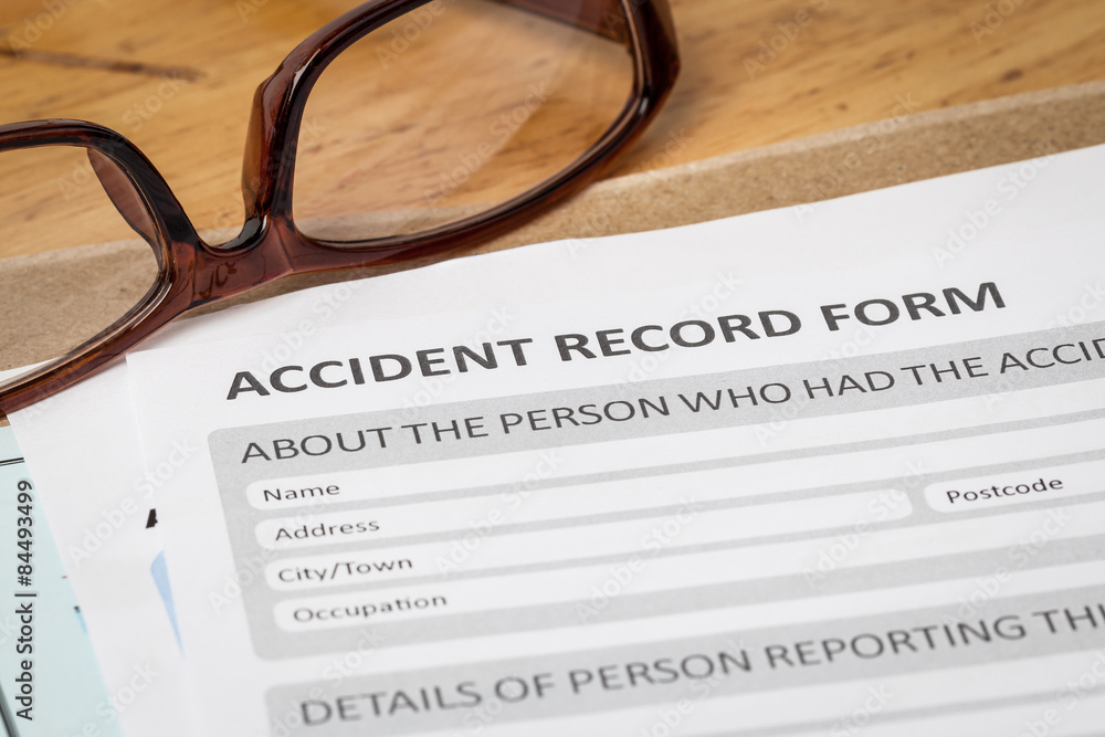 Accident report application form on brown envelope and eyeglass, Accident report application form on brown envelope and eyeglass,