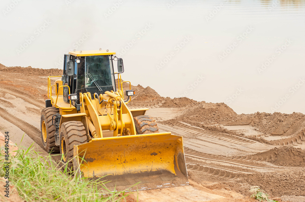 Front end loader working on the waterfront. Front end loader working on the waterfront.