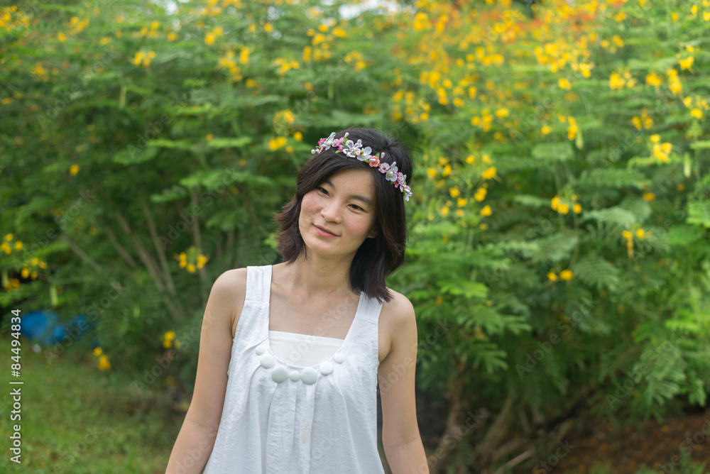 Fashion Beautiful Asian woman with flower crown in garden Fashion Beautiful Asian woman with flower crown in garden