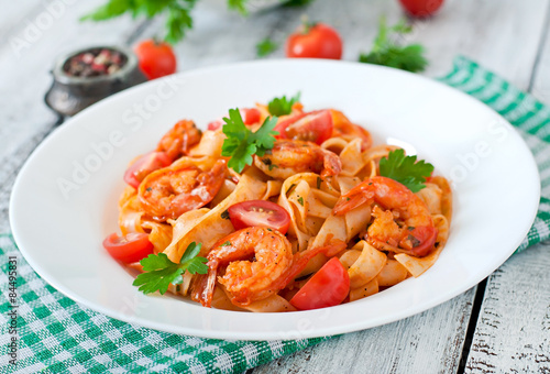 Fettuccine pasta with shrimp, tomatoes and herbs