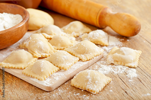 Freshly made homemade delicious homemade ravioli with a roller