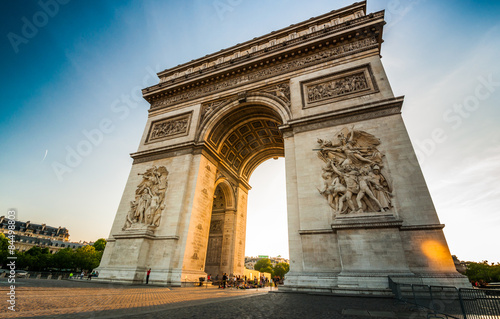 Triumphal Arch at the end of Champs-Elysees street before sunset