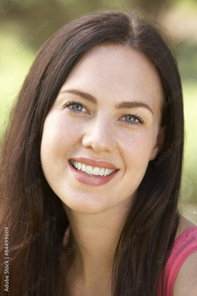 Portrait Of Young Woman Relaxing In Countryside Portrait Of Young Woman Relaxing In Countryside