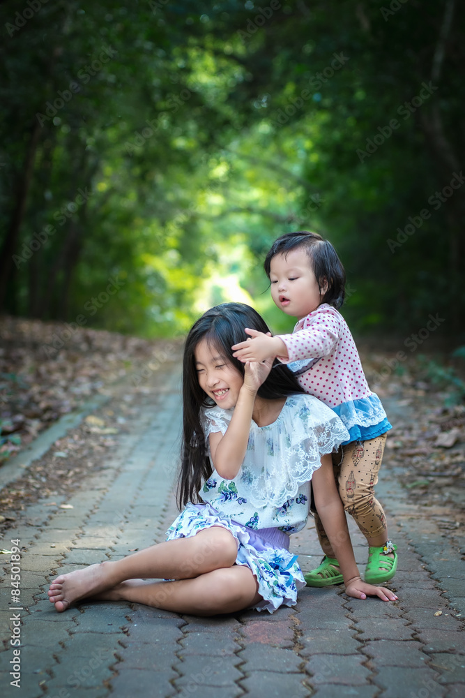 Sister taking care of her sister Sister taking care of her sister