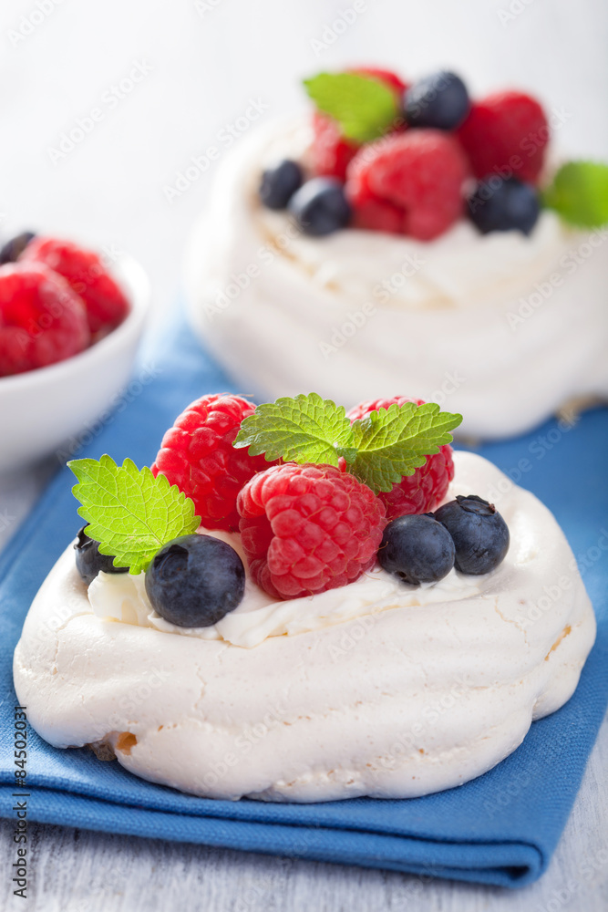 pavlova meringue cake with cream and berry pavlova meringue cake with cream and berry