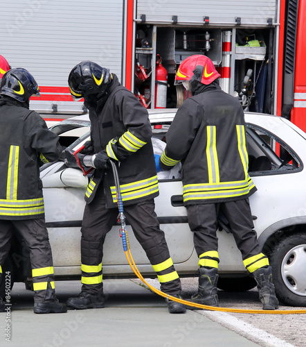 firefighters relieve an injured after a road accident