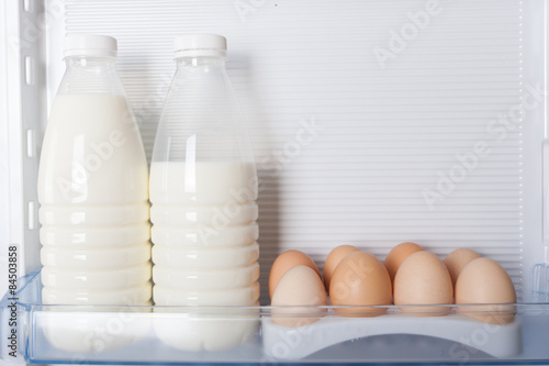 milk and eggs in door refrigerator