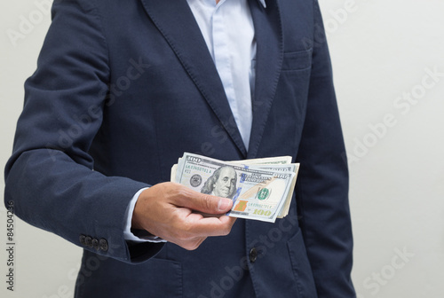 Businessman hand with money, United stage dollar bill
