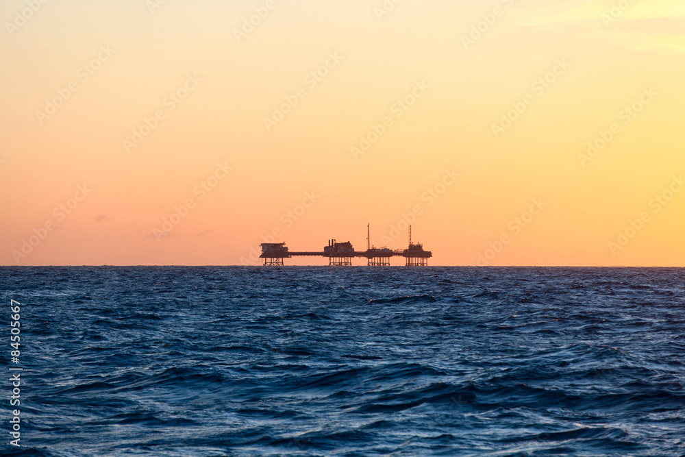 Oil platform in sunrise time