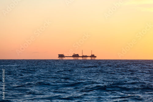 Oil platform in sunrise time © Lukasz Z