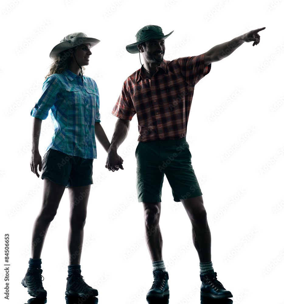 couple trekker trekking pointing nature silhouette couple trekker trekking pointing nature silhouette