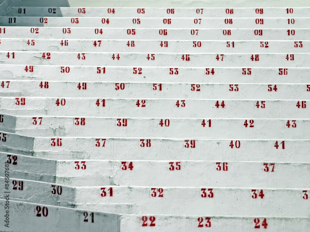 Naklejka premium red numbers in the stands of the stadium of football