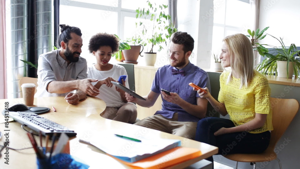 happy business team with smartphones in office happy business team with smartphones in office