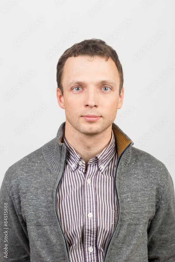 Young serious Caucasian man in casual clothing Young serious Caucasian man in casual clothing