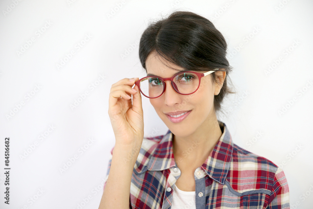 Portrait of brunette girl with red eyeglasses on, isolated Portrait of brunette girl with red eyeglasses on, isolated