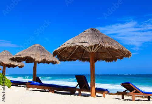 Beach chairs on exotic tropical sand beach