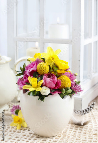 Easter floral arrangement in white egg shell