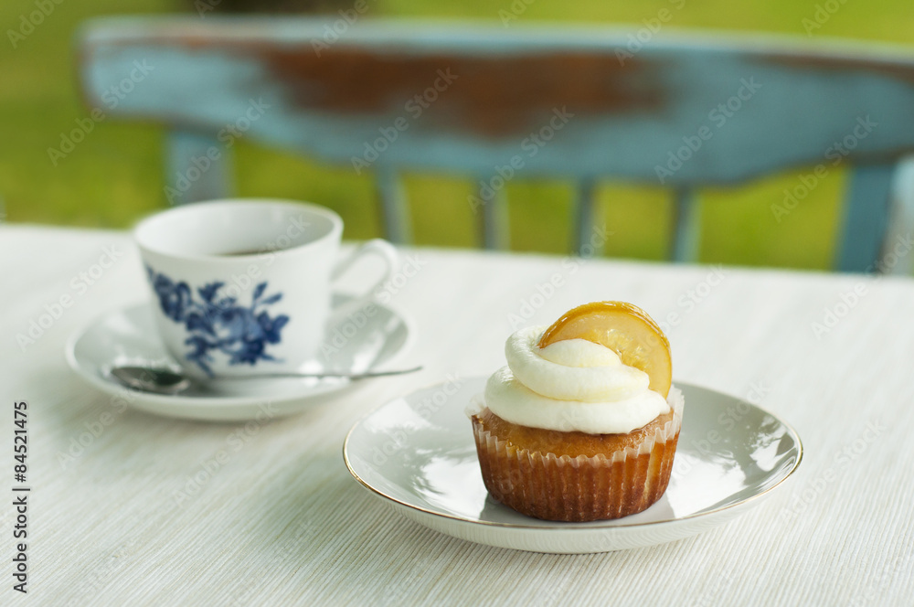 Lemon cupcake with cup of coffee Lemon cupcake with cup of coffee