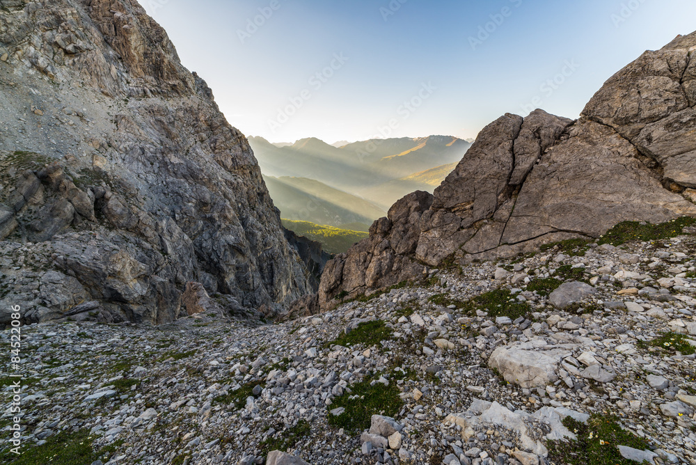 Last sunbeams on alpine valley