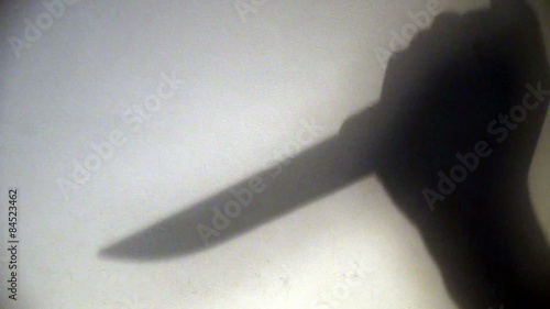 Shadow of a Knife Stabbing Down