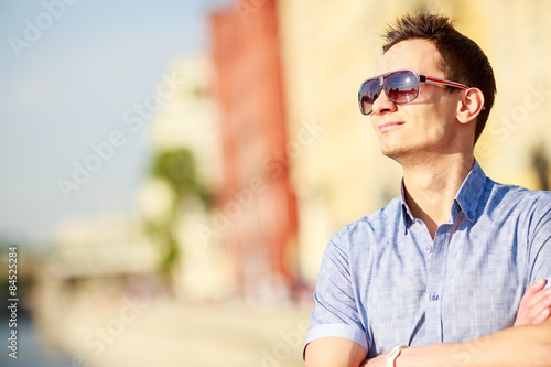 Portrait of a handsome young man with sunglasses © Sergey