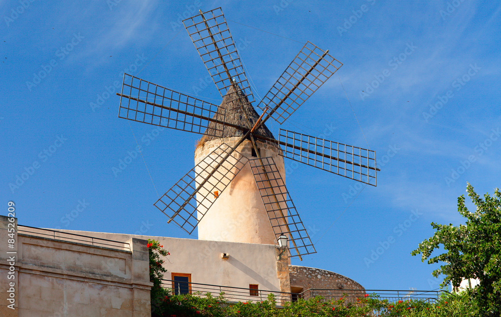 Old style windmill on the blue sky. Majorca, Spain