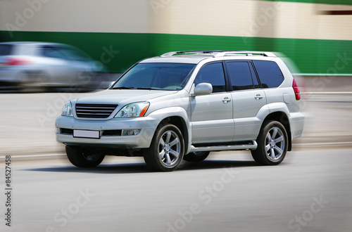 SUV moves on the city street