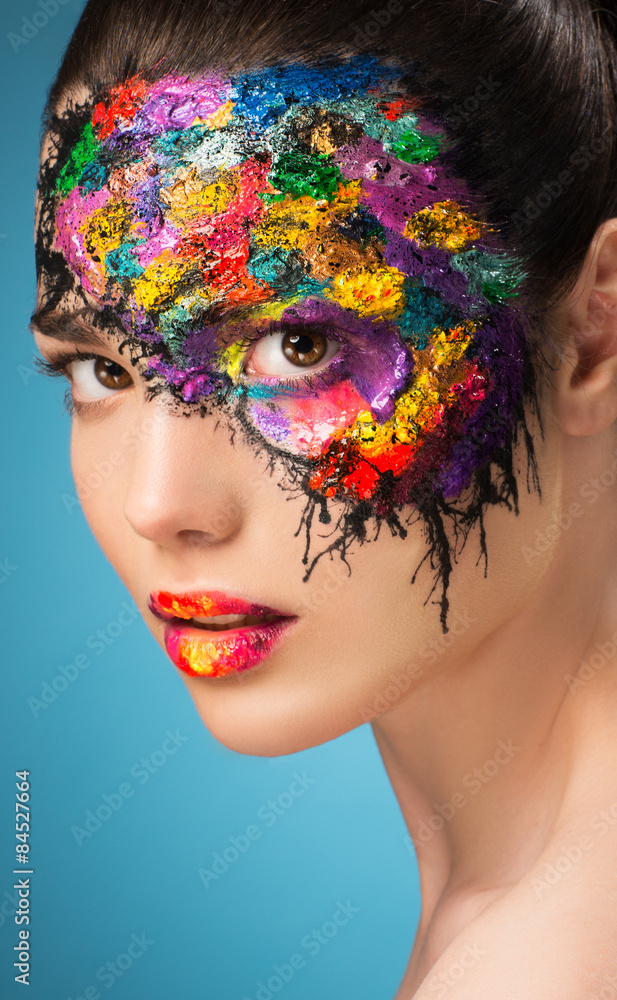 Fototapeta premium Beautiful fashion woman color face art.