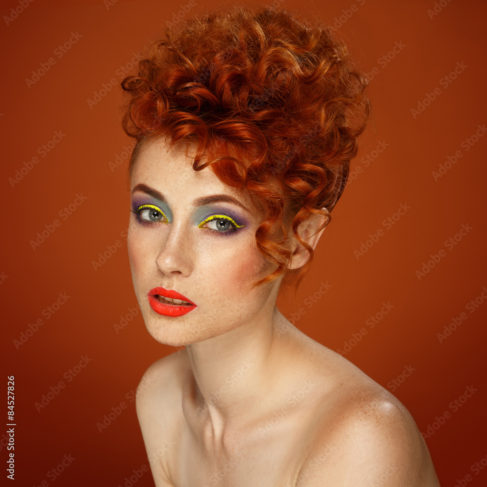 Red-haired. Beautiful girl with bright makeup Red-haired. Beautiful girl with bright makeup