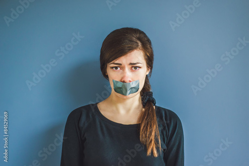 Foto girl with duct tape over her mouth