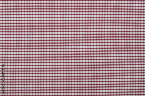 The fabric in the red cells, plaid, texture