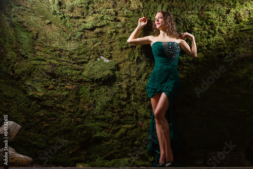 Wallpaper Mural Beautiful girl near a wall covered with moss Torontodigital.ca