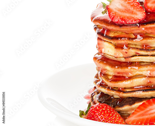 Delicious pancakes with strawberry isolated on white background