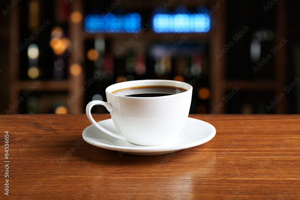 Cup of coffee on table in coffee shop