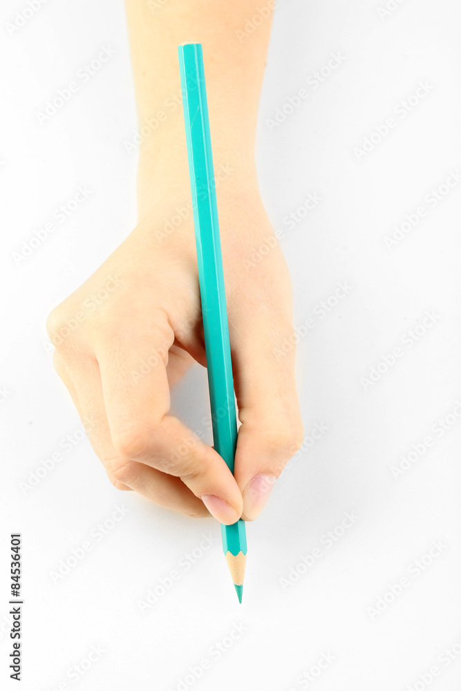 Female hand with colorful pencil isolated on white Female hand with colorful pencil isolated on white