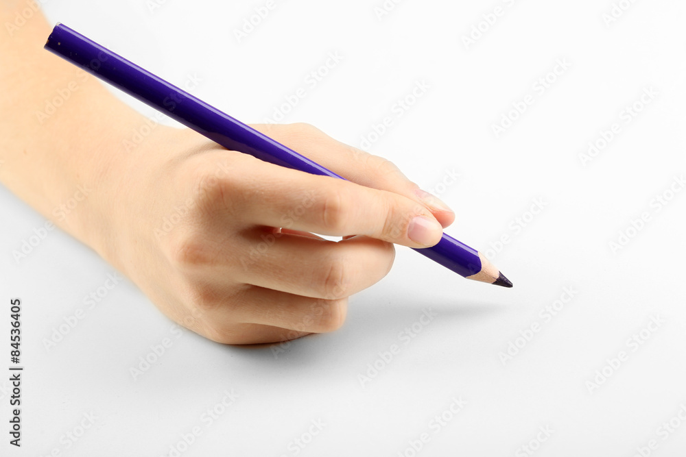Female hand with colorful pencil isolated on white Female hand with colorful pencil isolated on white
