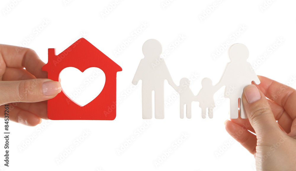 Female hands holding model of house and paper family isolated on white Female hands holding model of house and paper family isolated on white