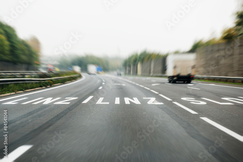 German autobahn with roadmarking sign to Linz, Austria photo