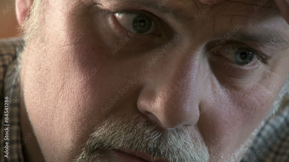 Big close up of man's face, deep in concentration during a chess game. Big close up of man's face, deep in concentration during a chess game.