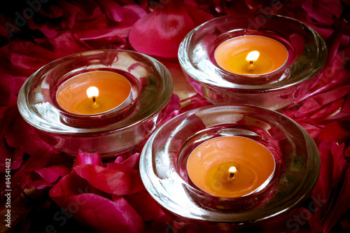 Close up of candles on the petals of flowers