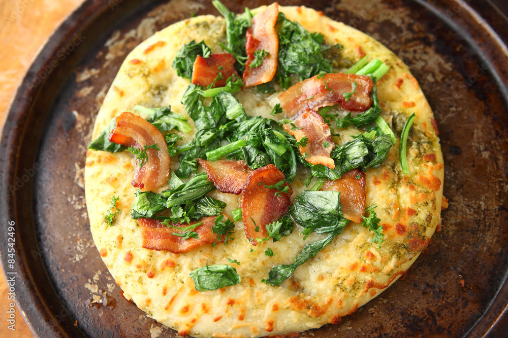 Bacon with greens pizza from above