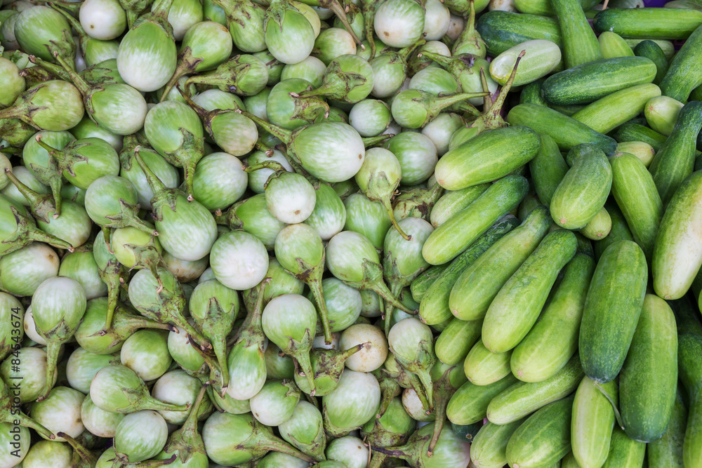Green eggplants and cucumbers for sale at market, Thailand Green eggplants and cucumbers for sale at market, Thailand