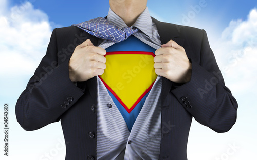 Принти на полотні businessman showing superhero icon underneath his shirt