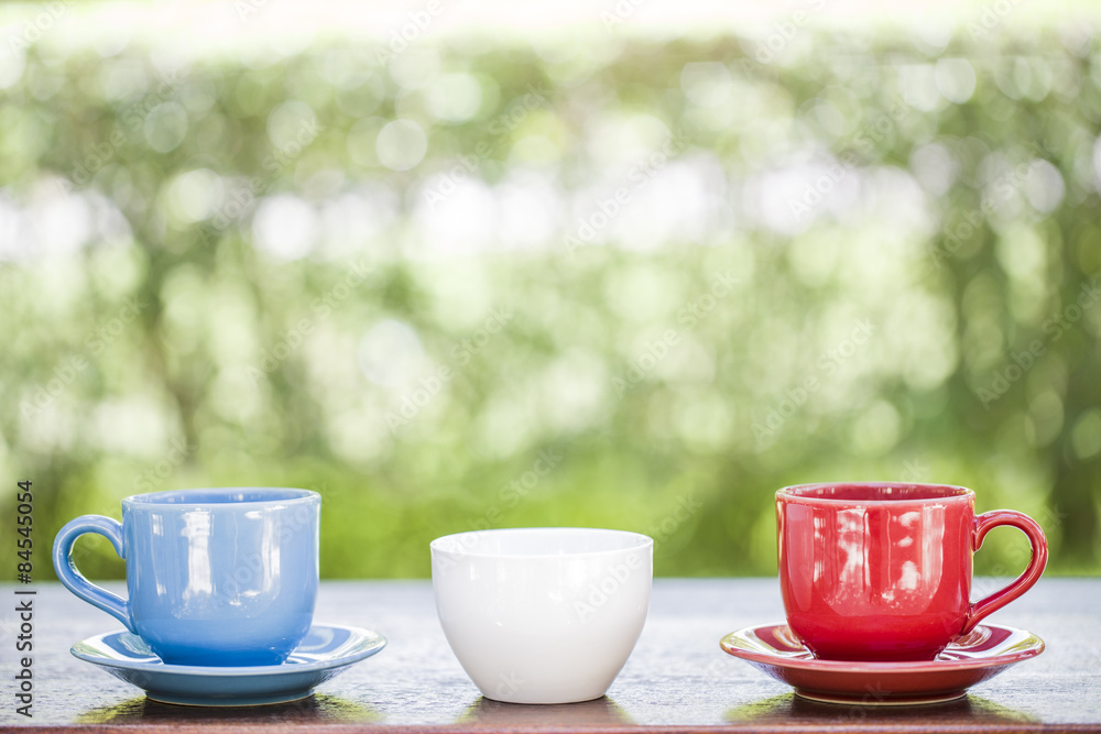 Three cup coffee on wooden and nature background Three cup coffee on wooden and nature background