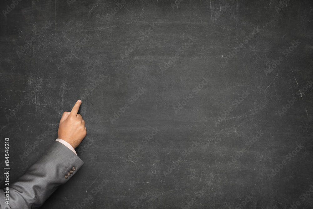 Blank blackboard with businessman hand pointing