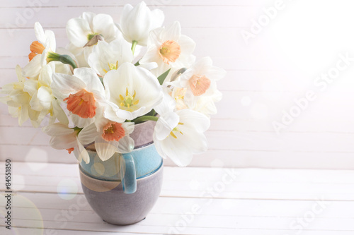 Background with fresh narcissus in vase