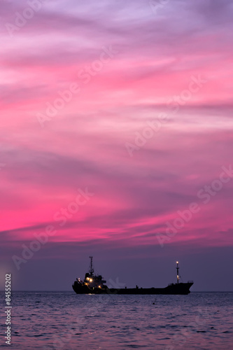 Cargo ship in South China Sea at dusk, Vietnam