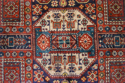 Vintage silky thin carpet with ethnic pattern