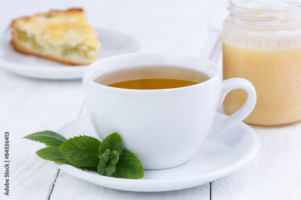 Mint tea with honey on wooden table. Mint tea with honey on wooden table.