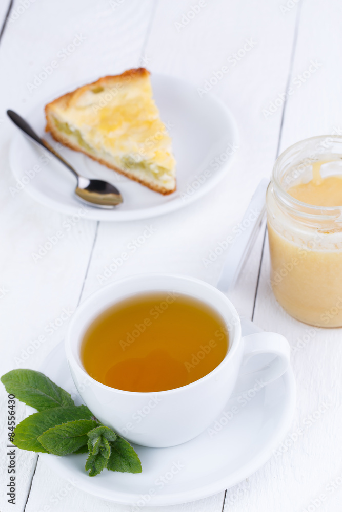 Mint tea with honey on wooden table. Mint tea with honey on wooden table.